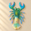 Langosta decorativa montata su parete