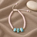 Pulsera de Cuarzo Rosa y Larimar sobre lino color topo